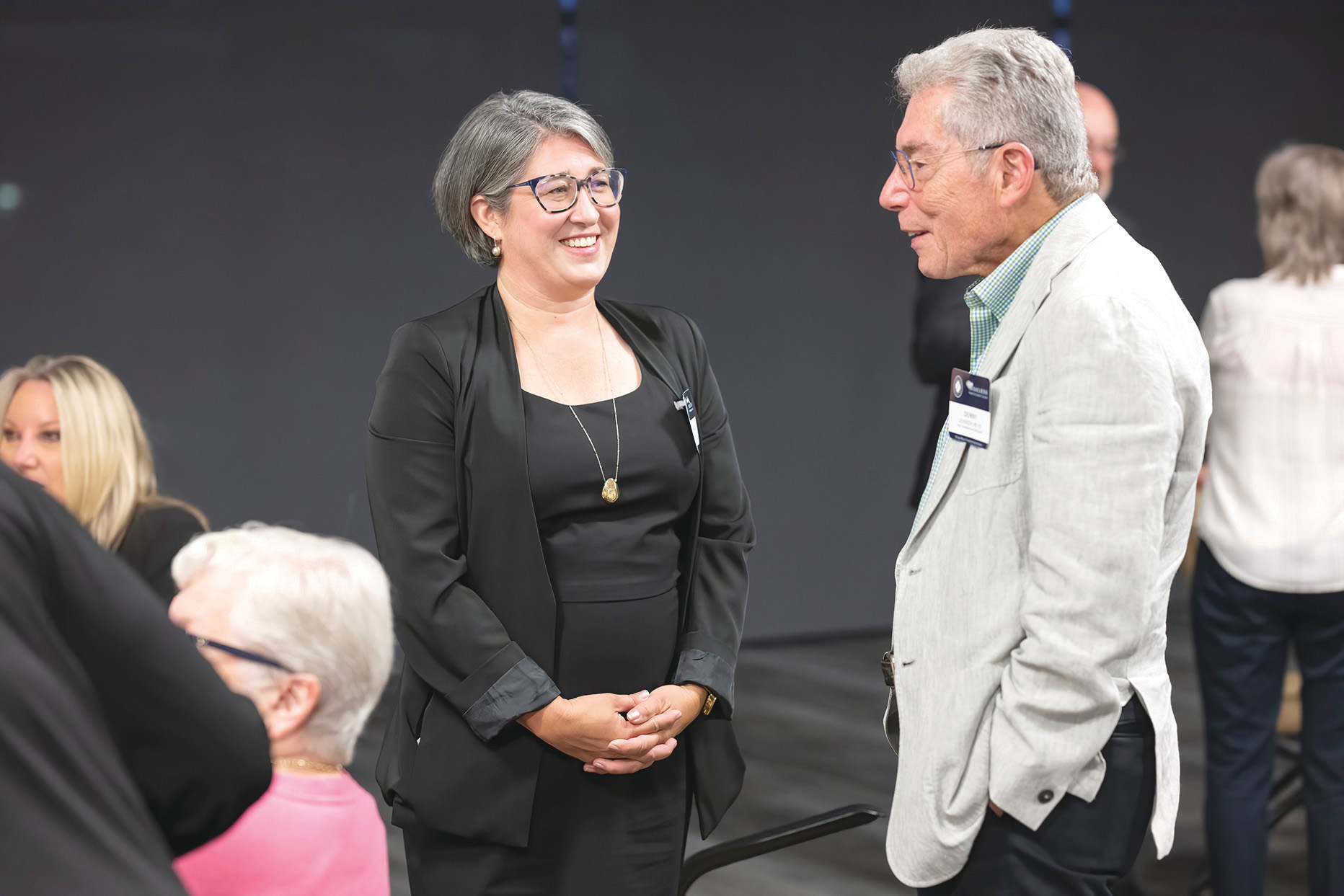 Amanda Simanek, PhD, MPH, talks with Denny Levinson, MD ‘67, during the Michael Reese Scholarship dinner.